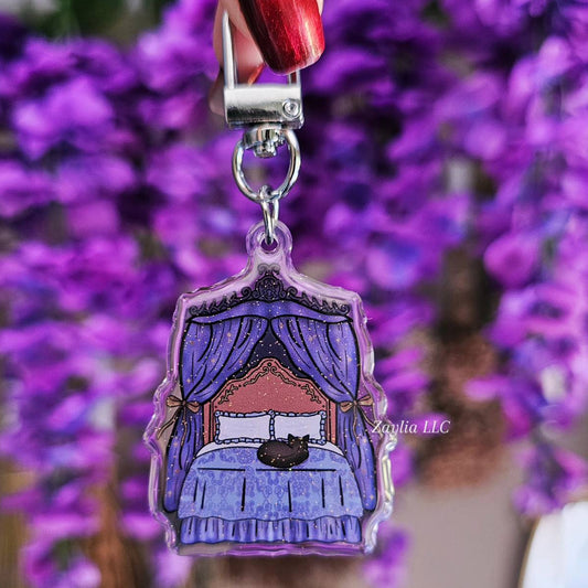 Black Cat Resting on Whimsical Bed Acrylic Keychain