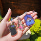 Black Cat Resting on Whimsical Bed Acrylic Keychain